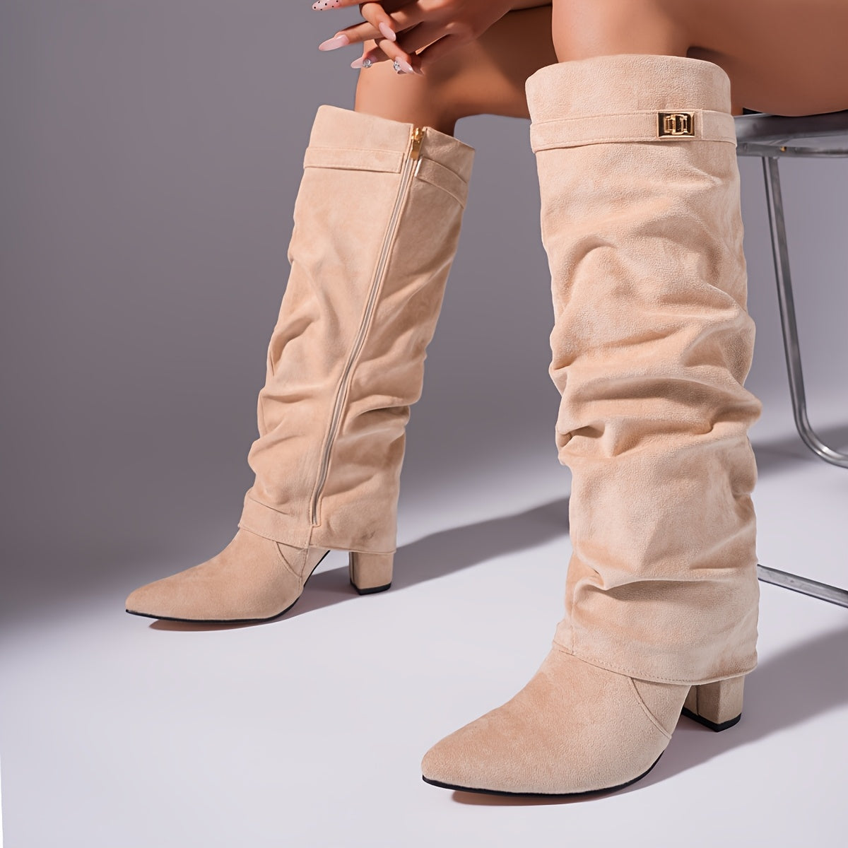Off-white suede-look boots with side zipper and gold buckle, pointed toe, chunky heel