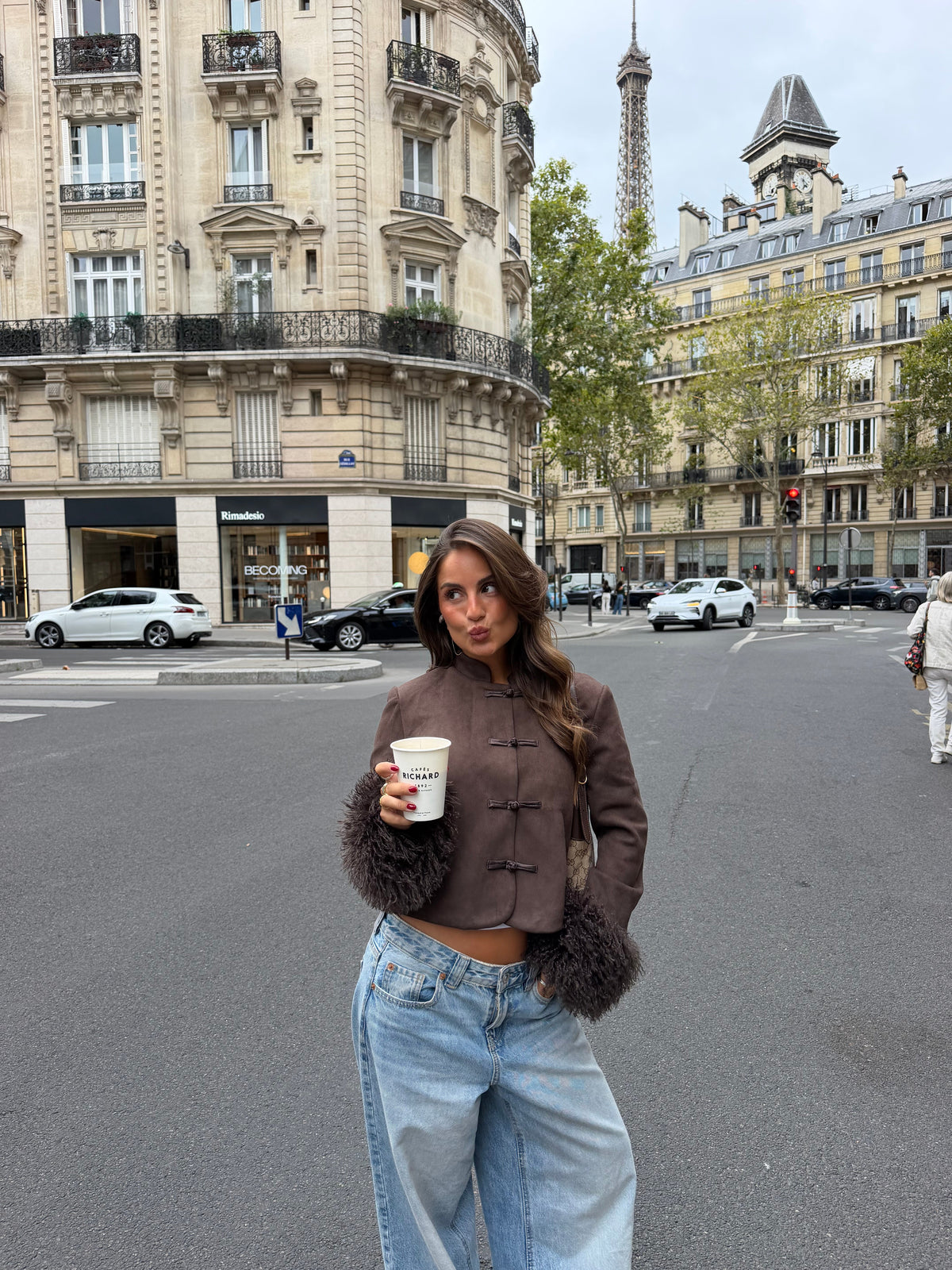 Brown cropped jacket with button front and black faux-fur sleeve cuffs