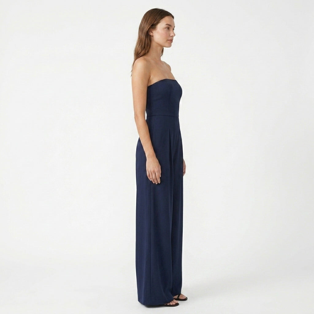 Strapless navy wide-leg evening jumpsuit, side view with fitted bodice