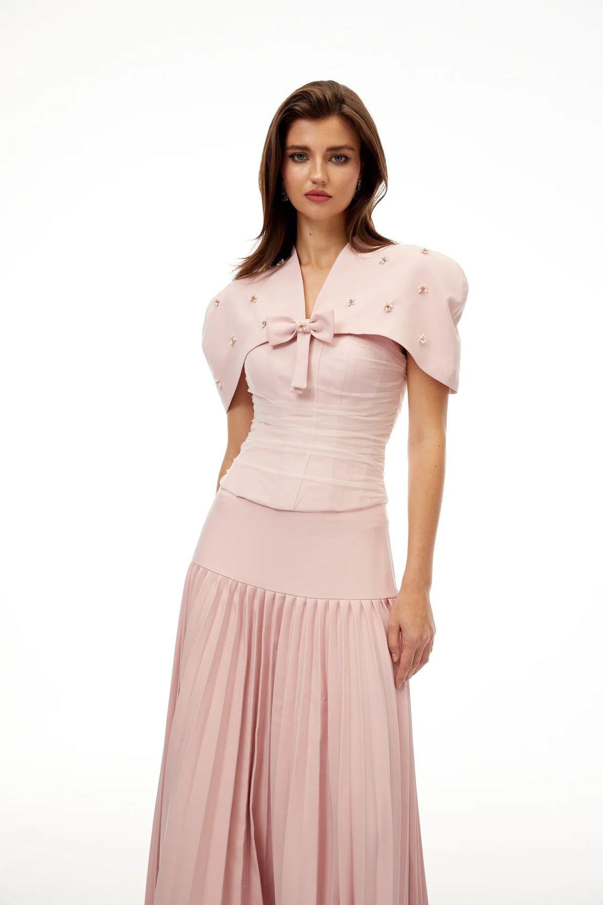 Blush corset top with bow-front off-shoulder short sleeves and pleated maxi skirt