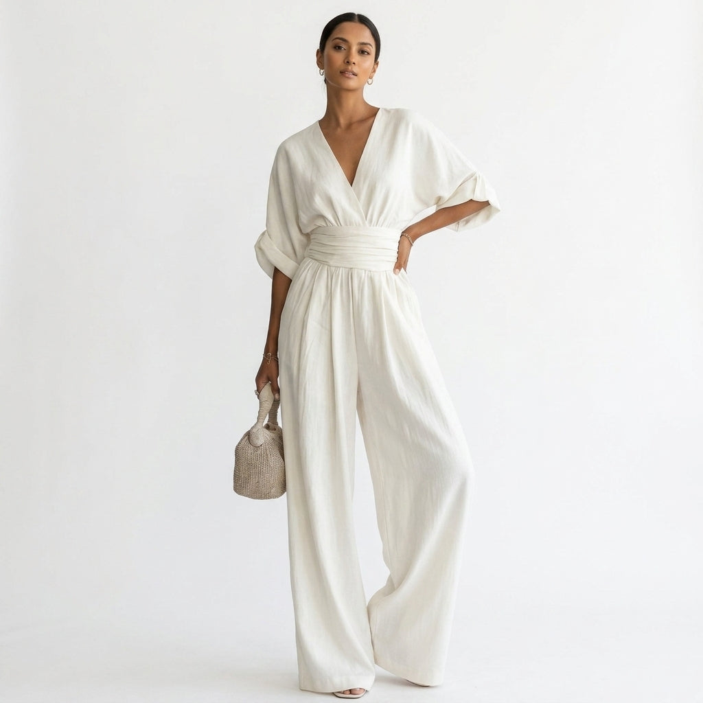 White deep V-neck wide-leg jumpsuit with elastic waist and dolman sleeves