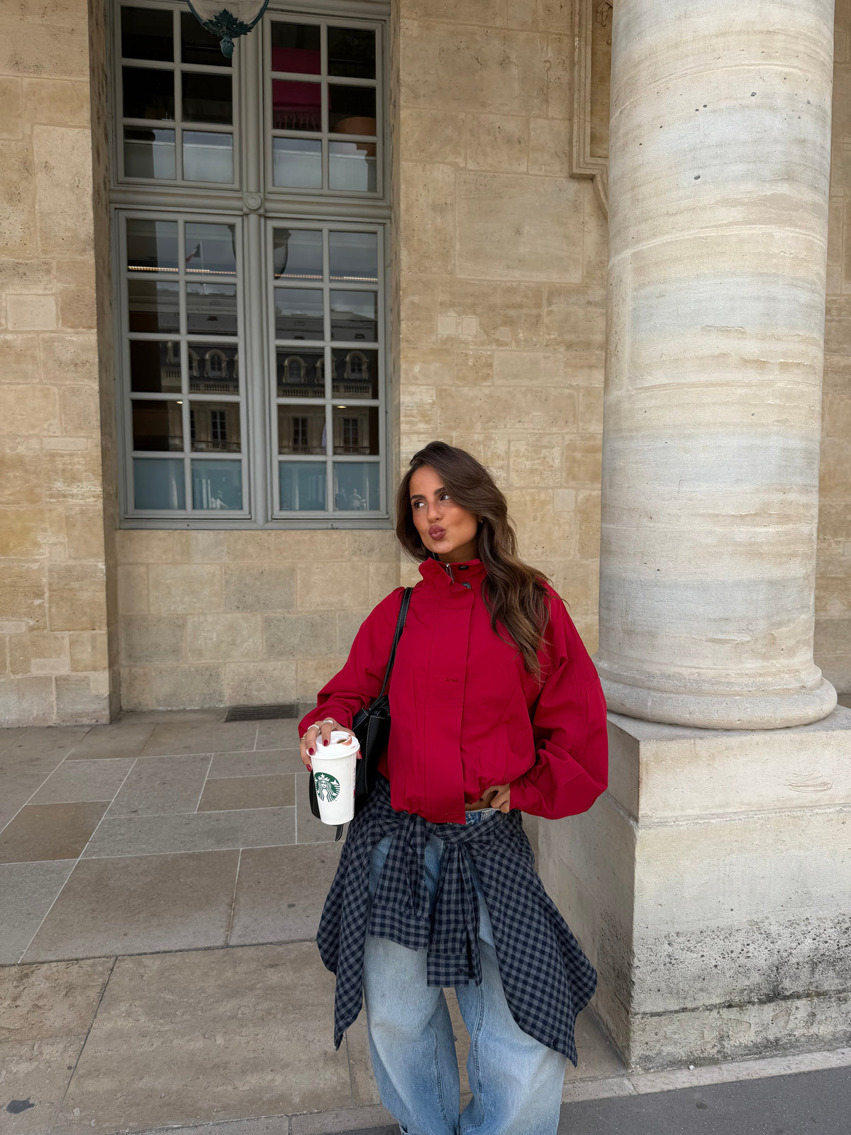 Red jacket with stand collar and button front, long sleeves, flap pockets