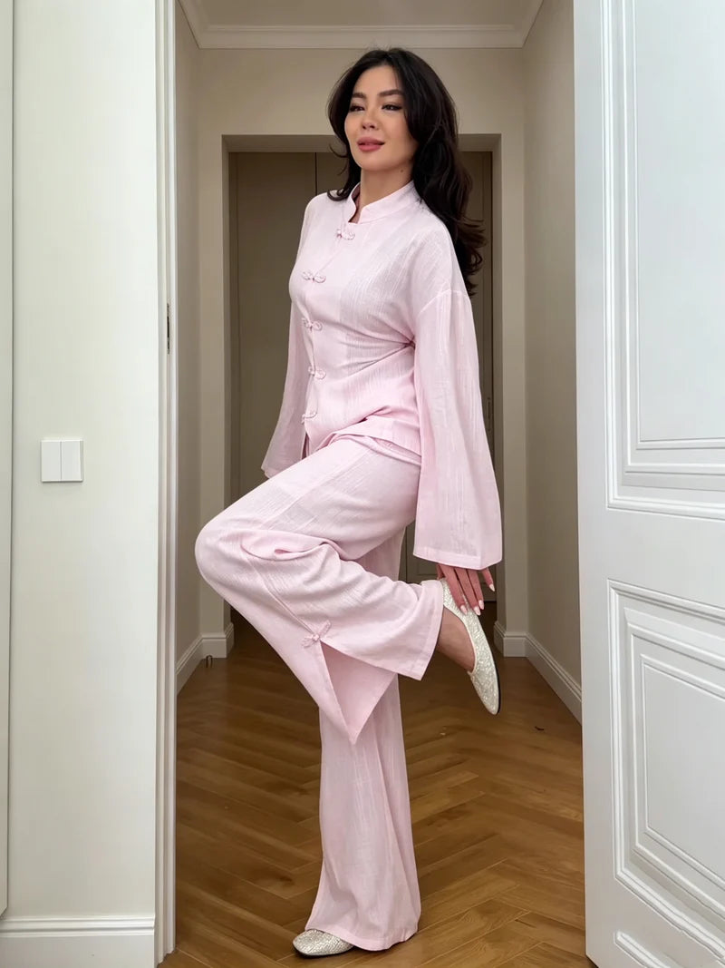 Pink linen co-ord set with buttoned jacket and wide-leg trousers, side view.