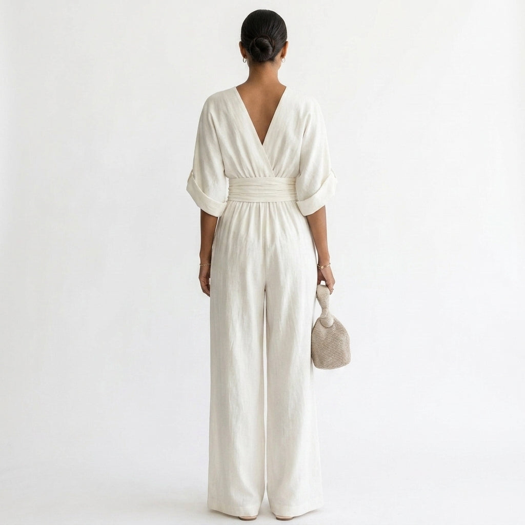 Off-white wide-leg jumpsuit with deep V back, gathered elastic waist, short sleeves