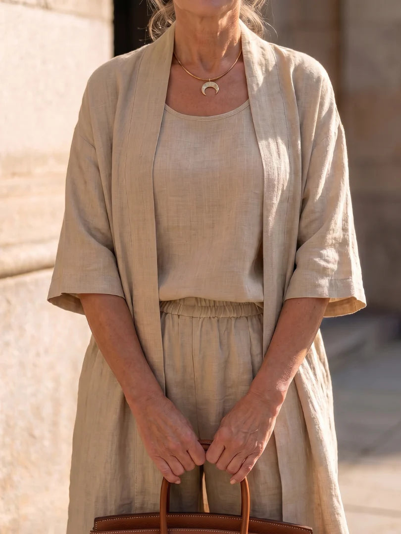 Beige co-ord set close-up: open kimono over camisole and gathered-waist trousers