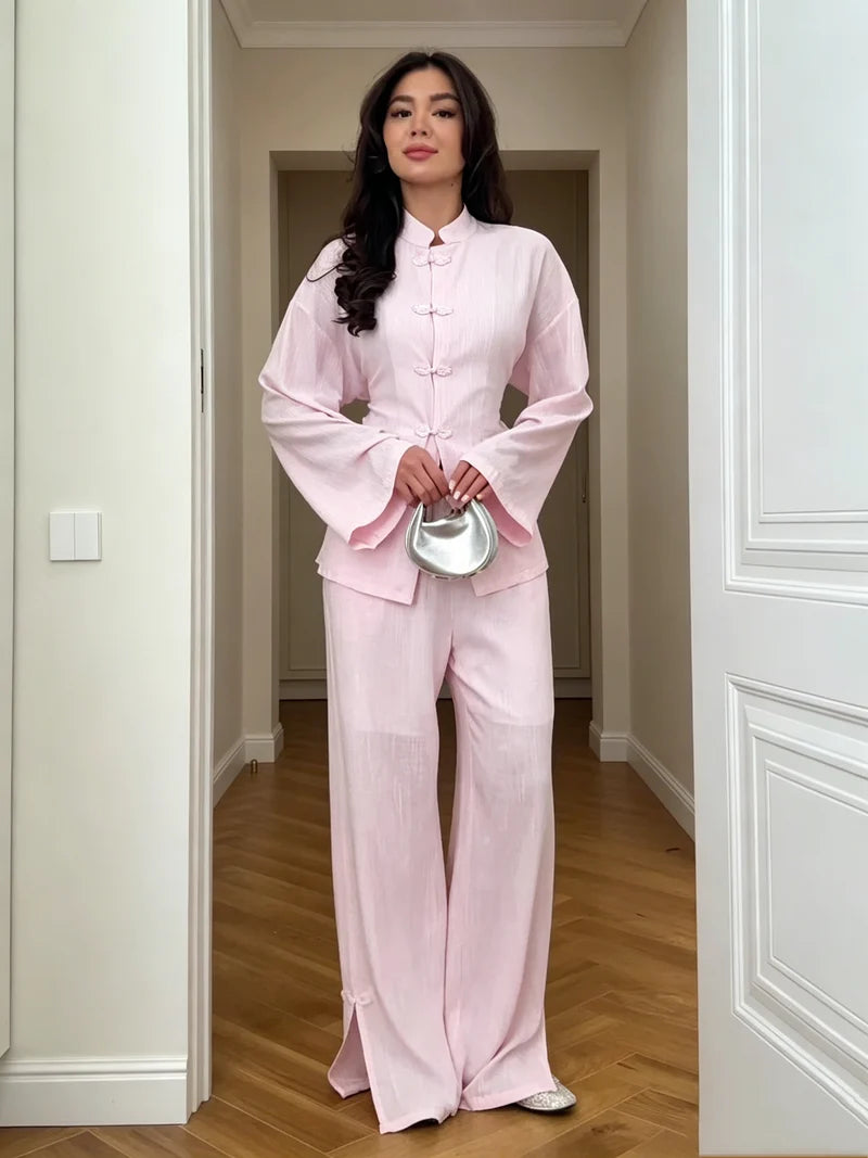 Pink linen co-ord set with buttoned jacket and wide-leg trousers, front view.