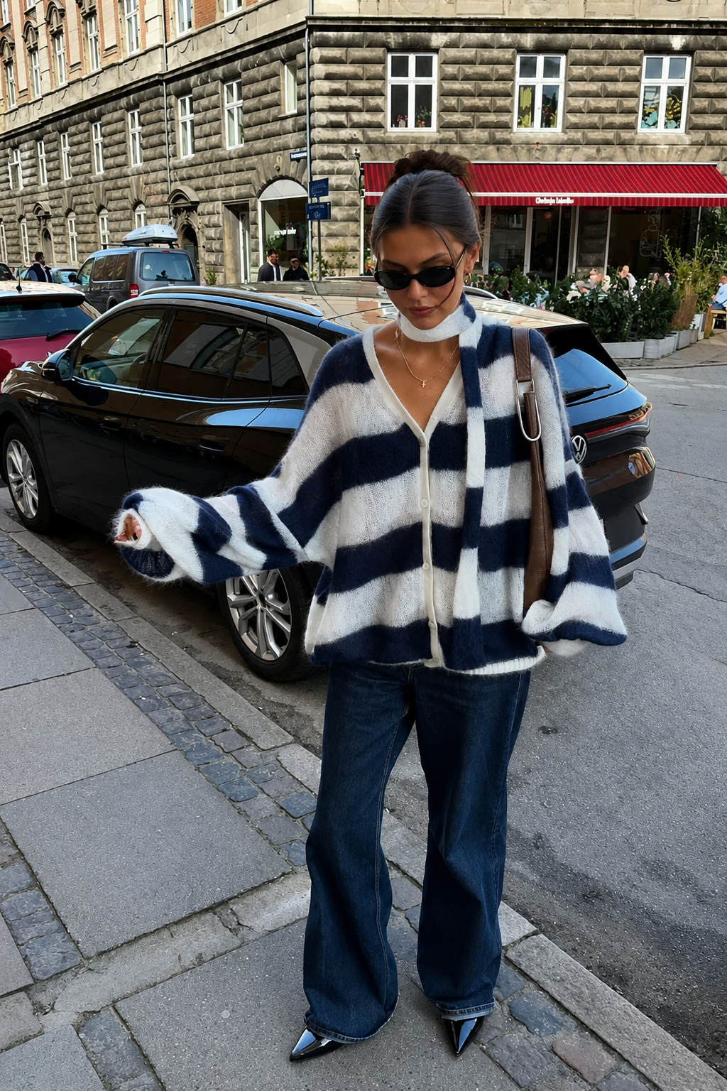 Navy-and-white striped fuzzy knit sweater with lace-up front, long sleeves, relaxed fit