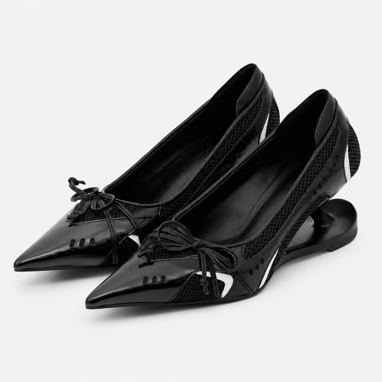 Black Mary Jane pumps with pointed toe, lace bow, and sculpted low heel