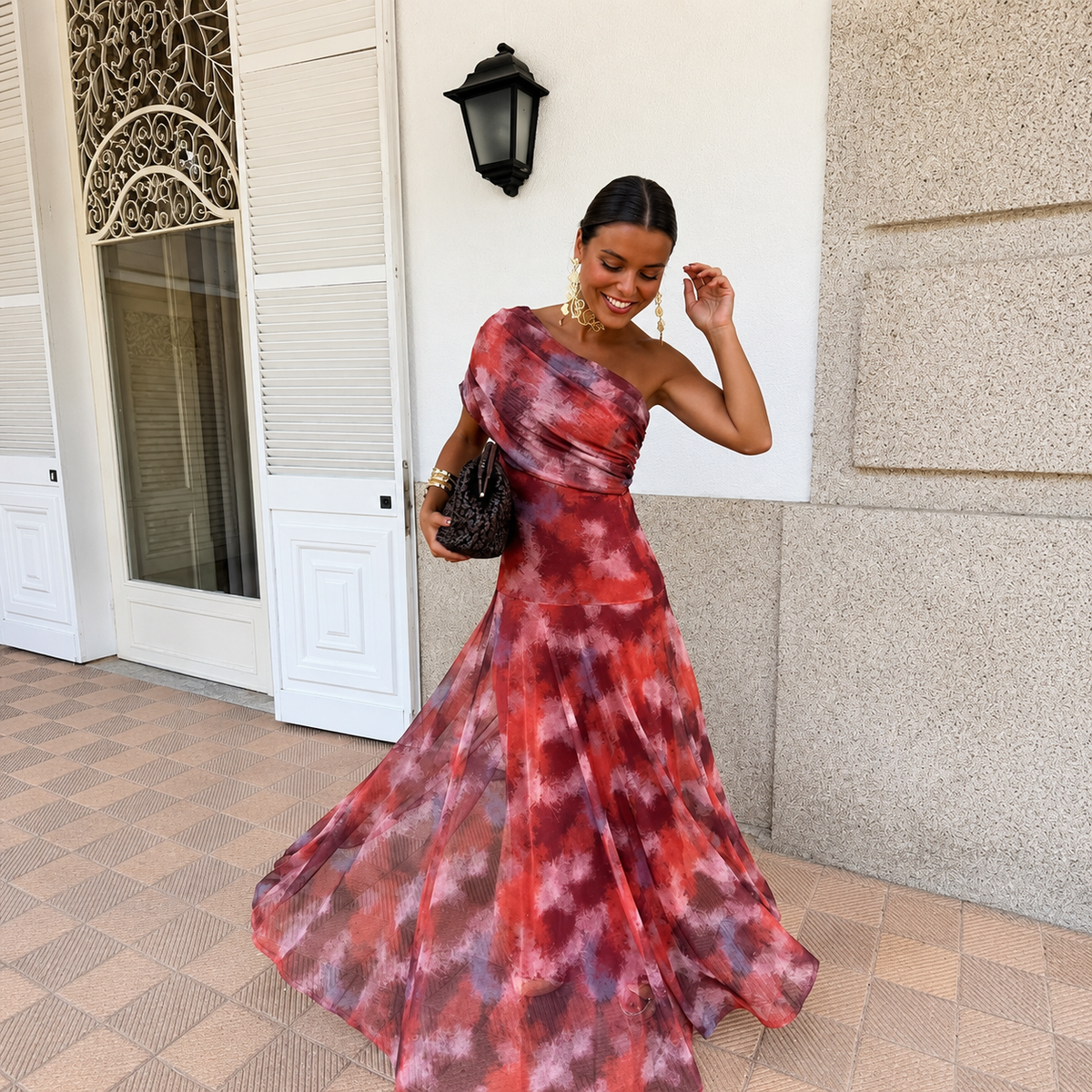 Red tie-dye one-shoulder sheath maxi dress with fitted bodice and flared skirt