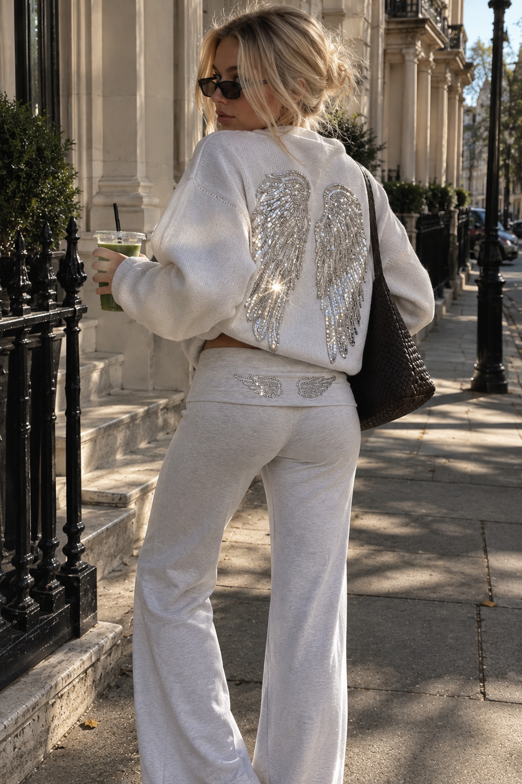 Gray oversized drop-shoulder hoodie with large sequin angel-wing graphic on back