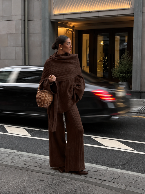 Dark brown knitted three-piece sweater set with draped cowl wrap and wide-leg pants