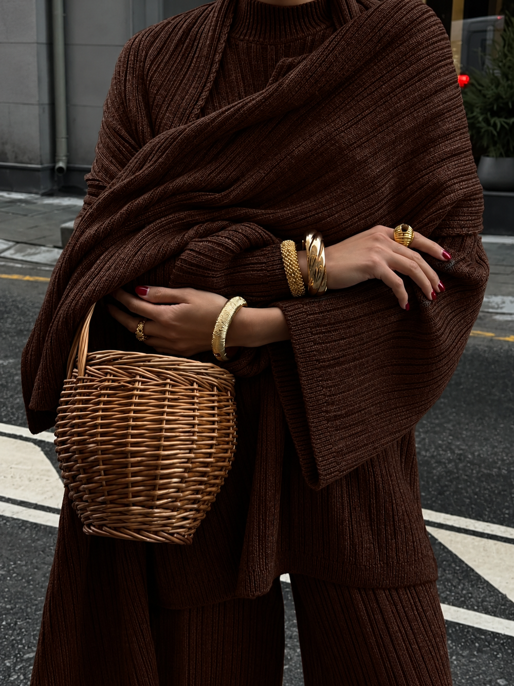 Brown knitted three-piece sweater set with chunky cowl wrap and wide-leg pants