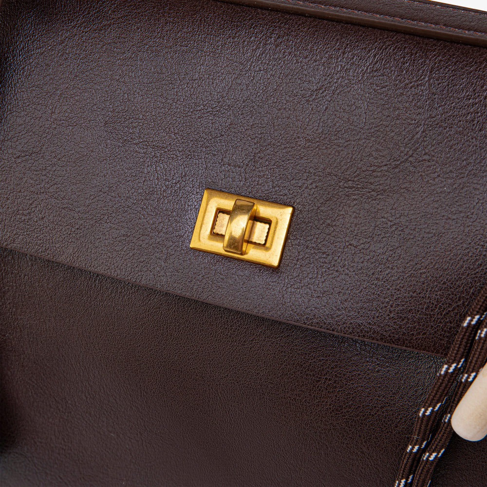 Ciara Vintage bag close-up of its gold-tone front turn-lock clasp