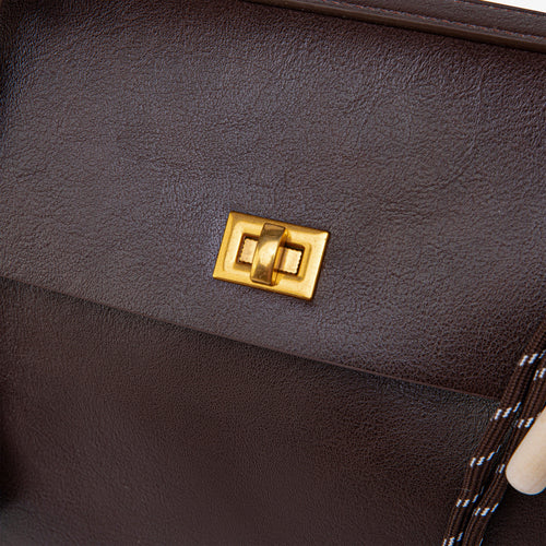 Ciara Vintage bag close-up of its gold-tone front turn-lock clasp