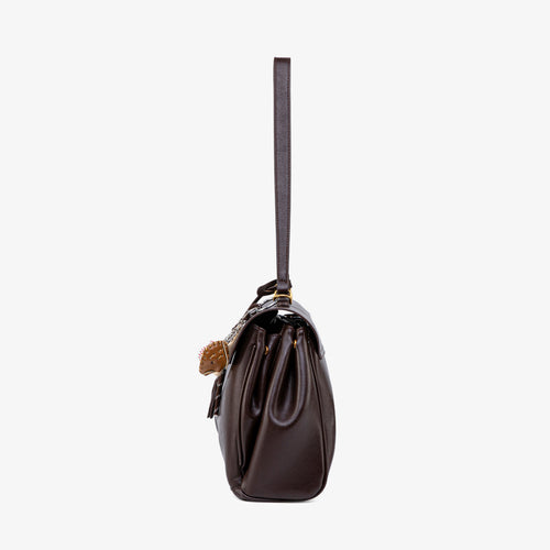 Ciara Vintage bag side profile showing its structured gusset and long strap