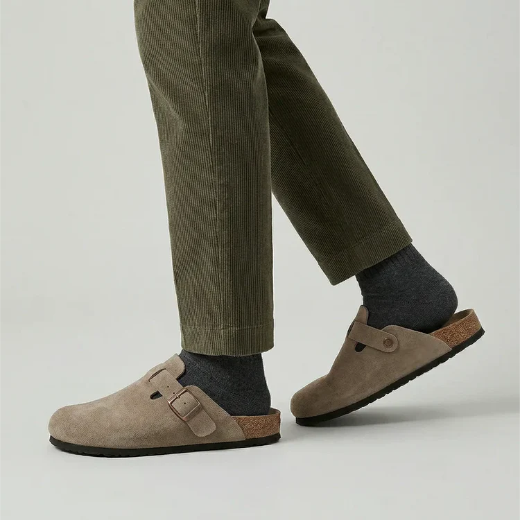 Suede buckle clog in dark olive green with adjustable metal buckle and rubber sole.