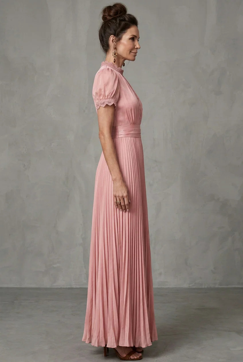 Pink maxi dress with pleated skirt, puff sleeves, and high neck
