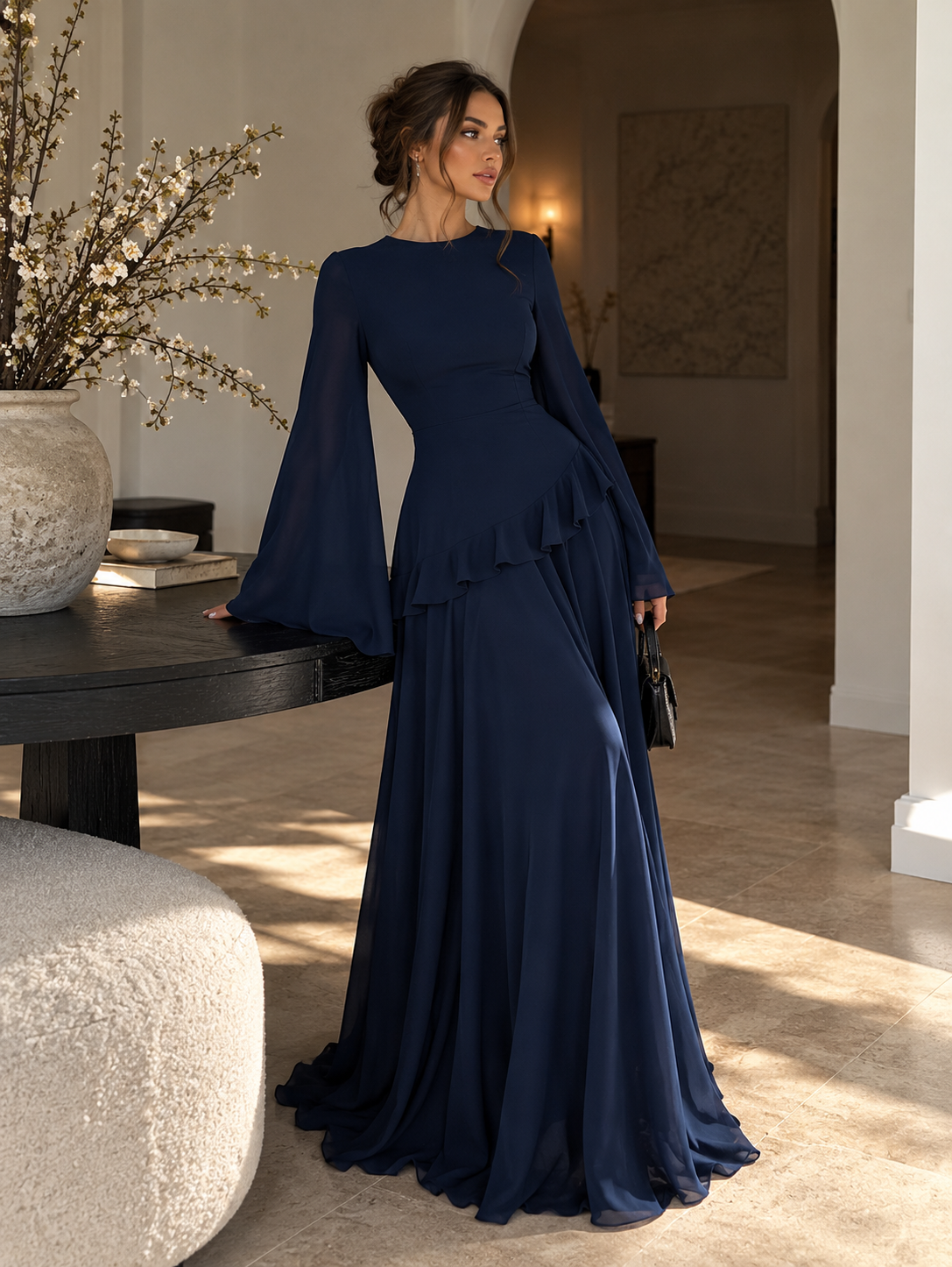 Navy tiered maxi dress with long bell sleeves and cascading ruffle skirt