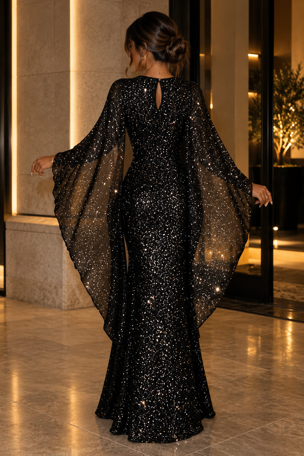 Black sequin wrap maxi dress with open back and long draped cape sleeves