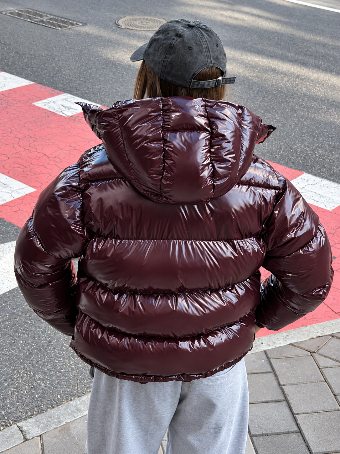 Glossy zip-hooded short puffer coat, burgundy back view with hood and quilted stripes
