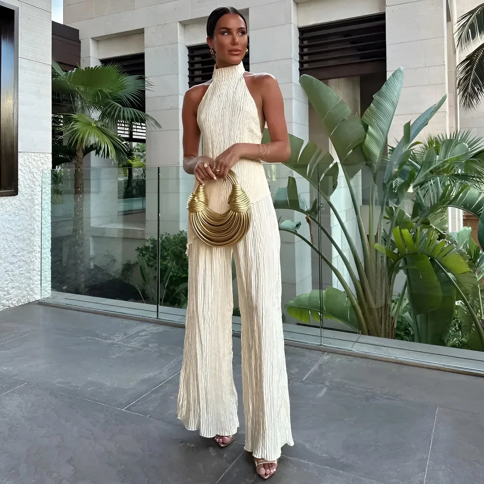 Cream pleated halter top and wide-leg trousers co-ord set, asymmetric drape