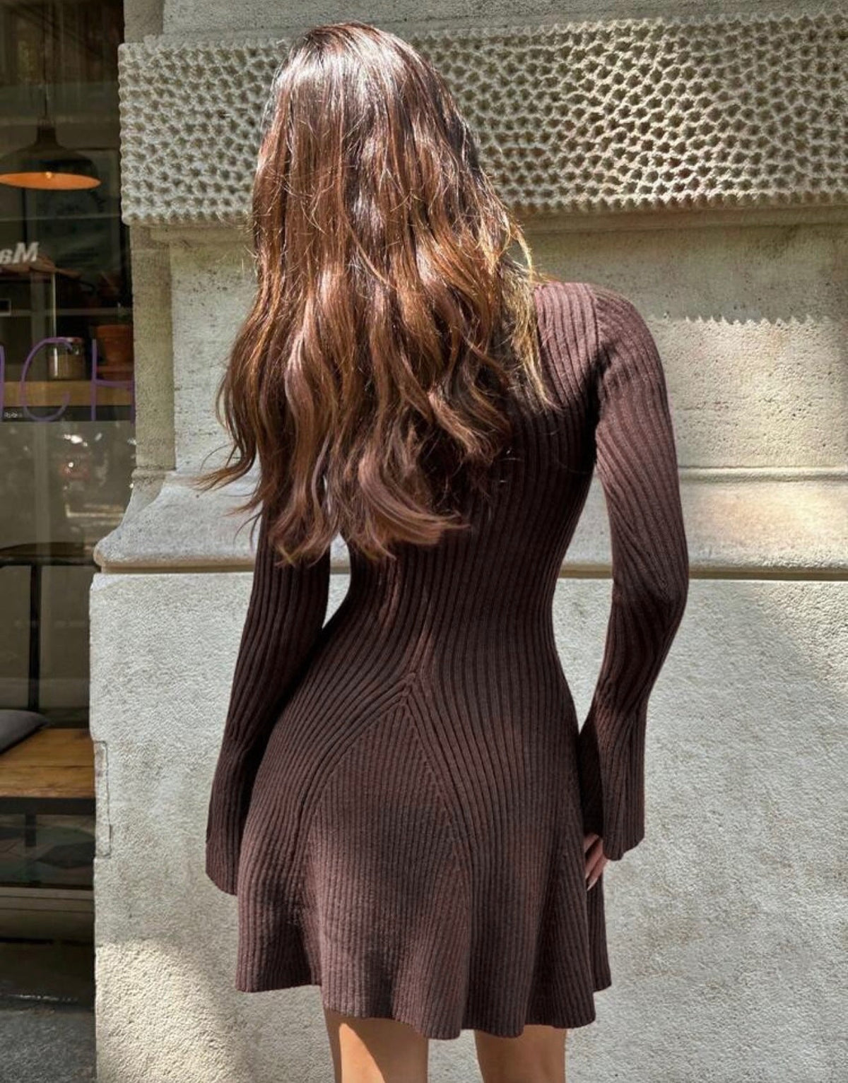 Brown ribbed knit mini dress with mock neck and bell sleeves, flared skirt
