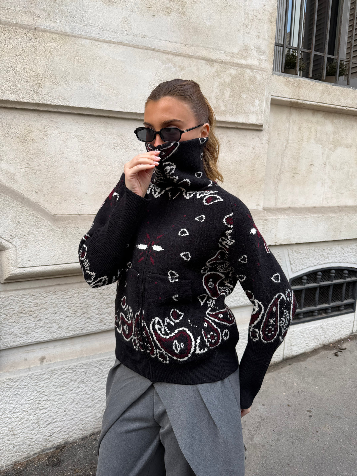 Women’s paisley zip-up knit cardigan, black with red and white pattern, full front zipper