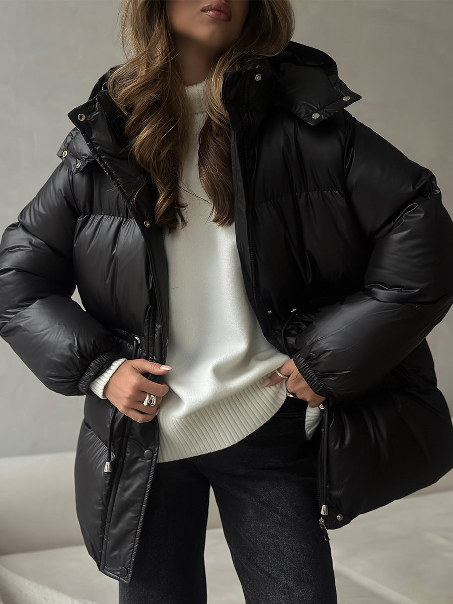 Black women’s hooded puffer jacket with front zipper and drawstring waist