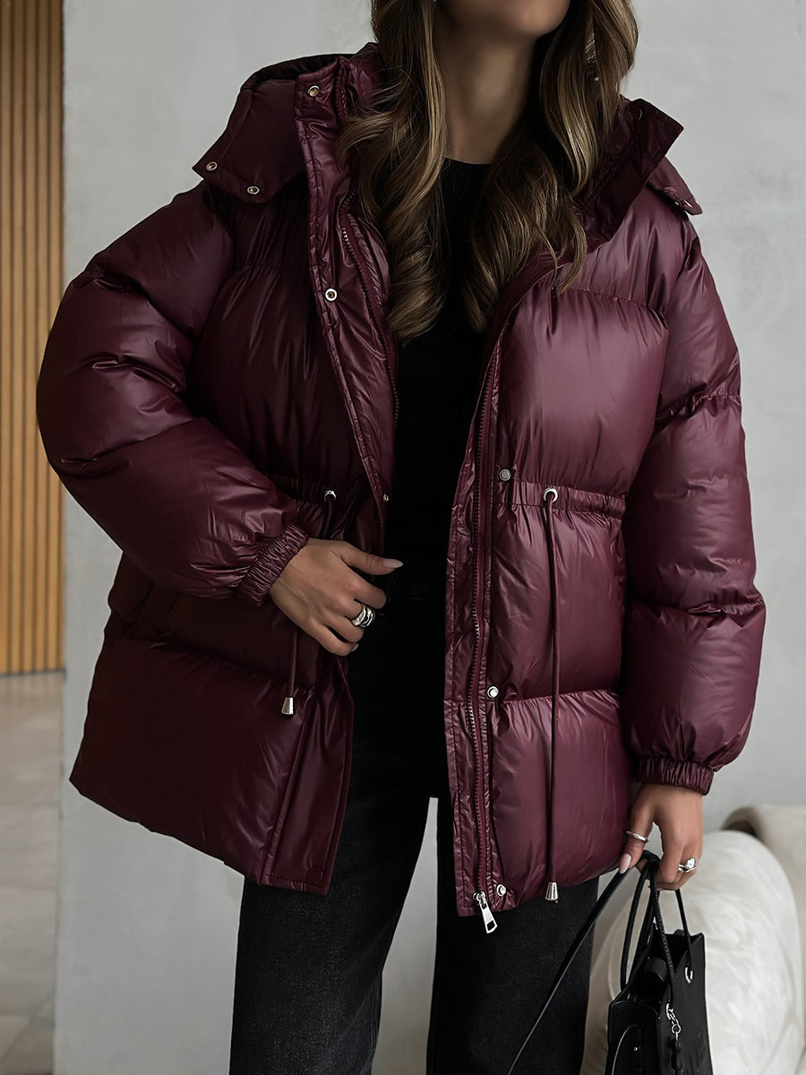 Wine red women’s hooded puffer jacket with front zipper and drawstring waist