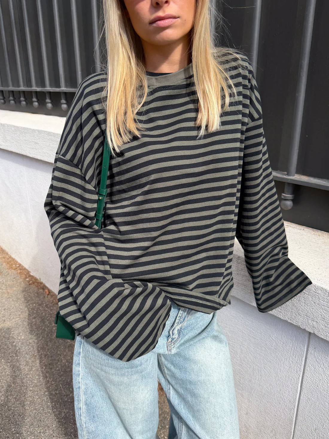 Women’s striped knit sweater in charcoal and gray, long bell sleeves