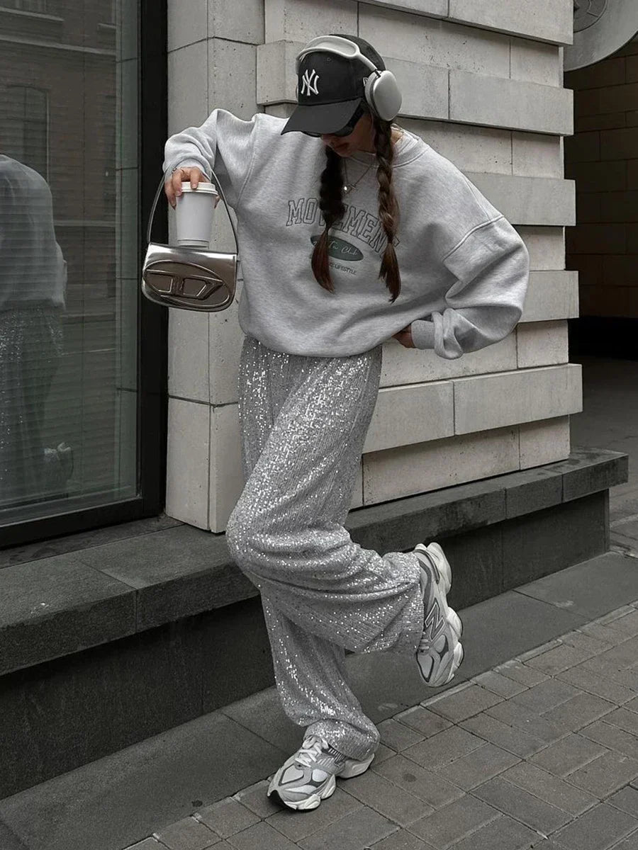 Silver sequin wide-leg trousers with glittery all-over texture and roomy flared legs