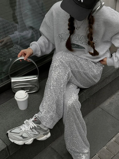 Silver sequin wide-leg trousers with soft drape and full-length sparkling coverage