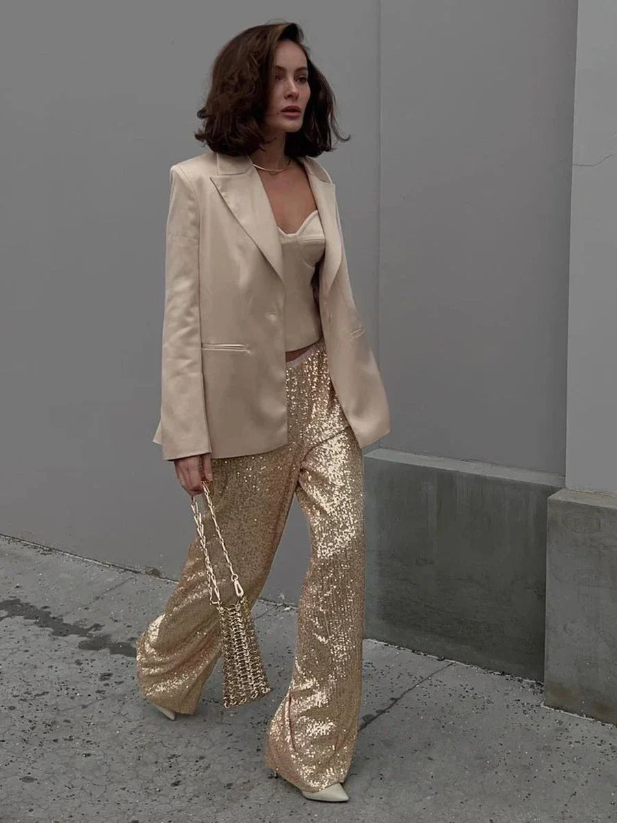 Gold sequin wide-leg party trousers with shimmering fabric and straight-to-flare shape