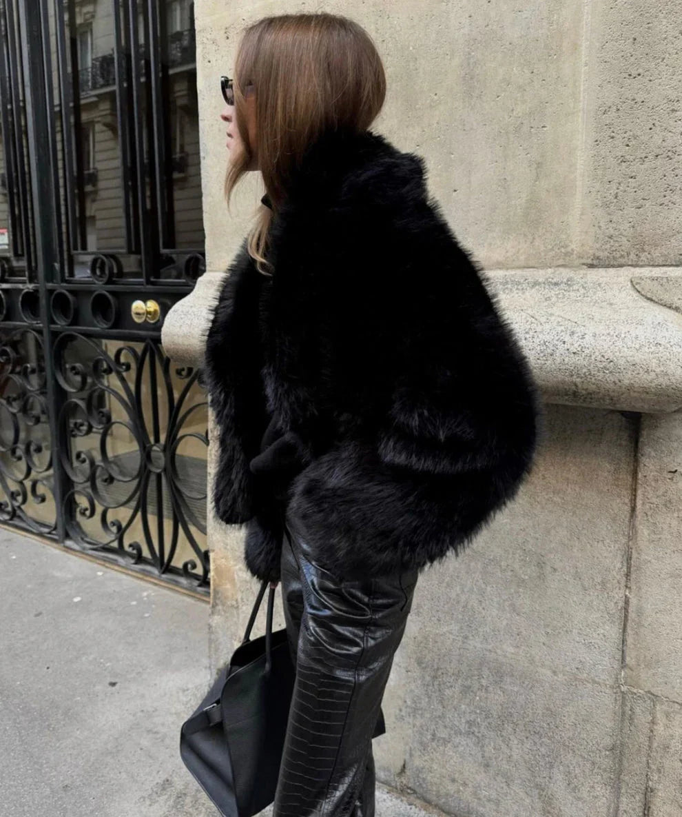 Black faux fur hooded coat with short hood and relaxed fit