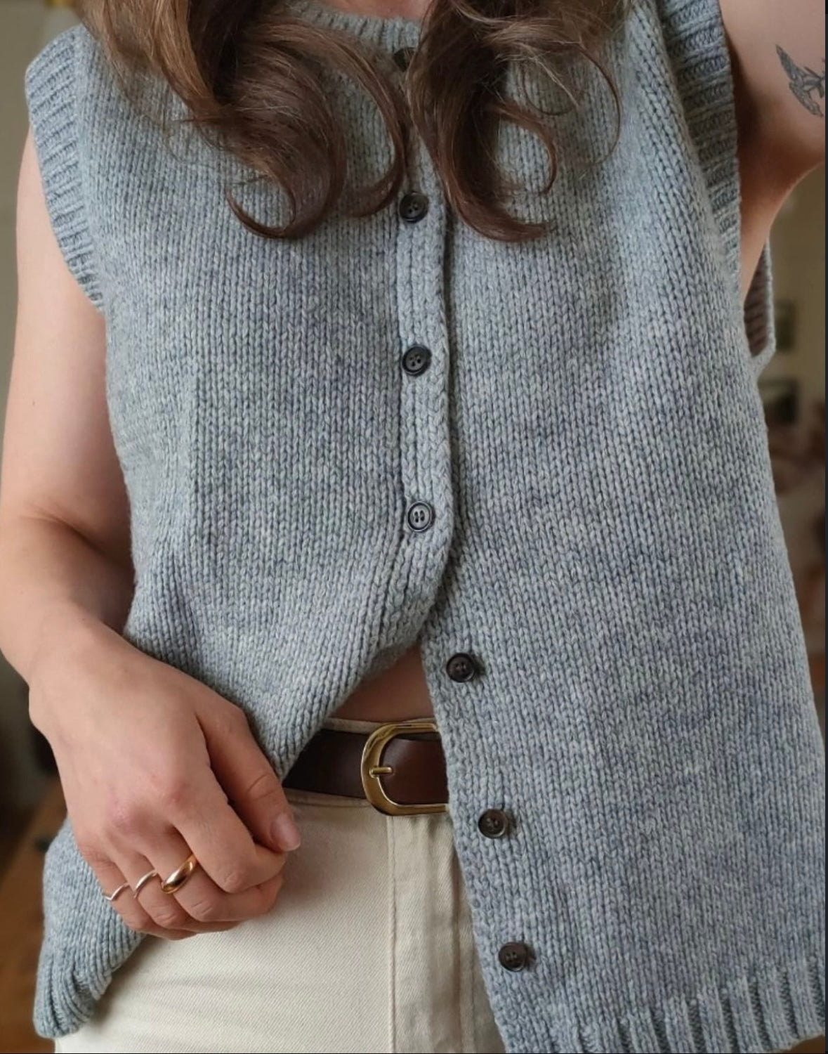 Women’s knitted button-front vest cardigan in blue-gray, ribbed hem and buttoned front