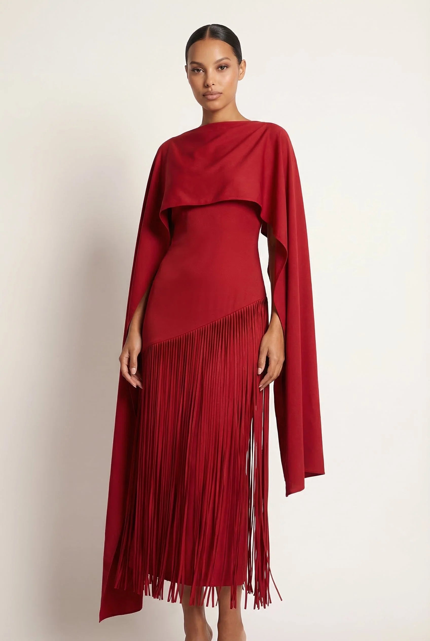 Burgundy/red strapless maxi gown with draped cape and long fringe skirt