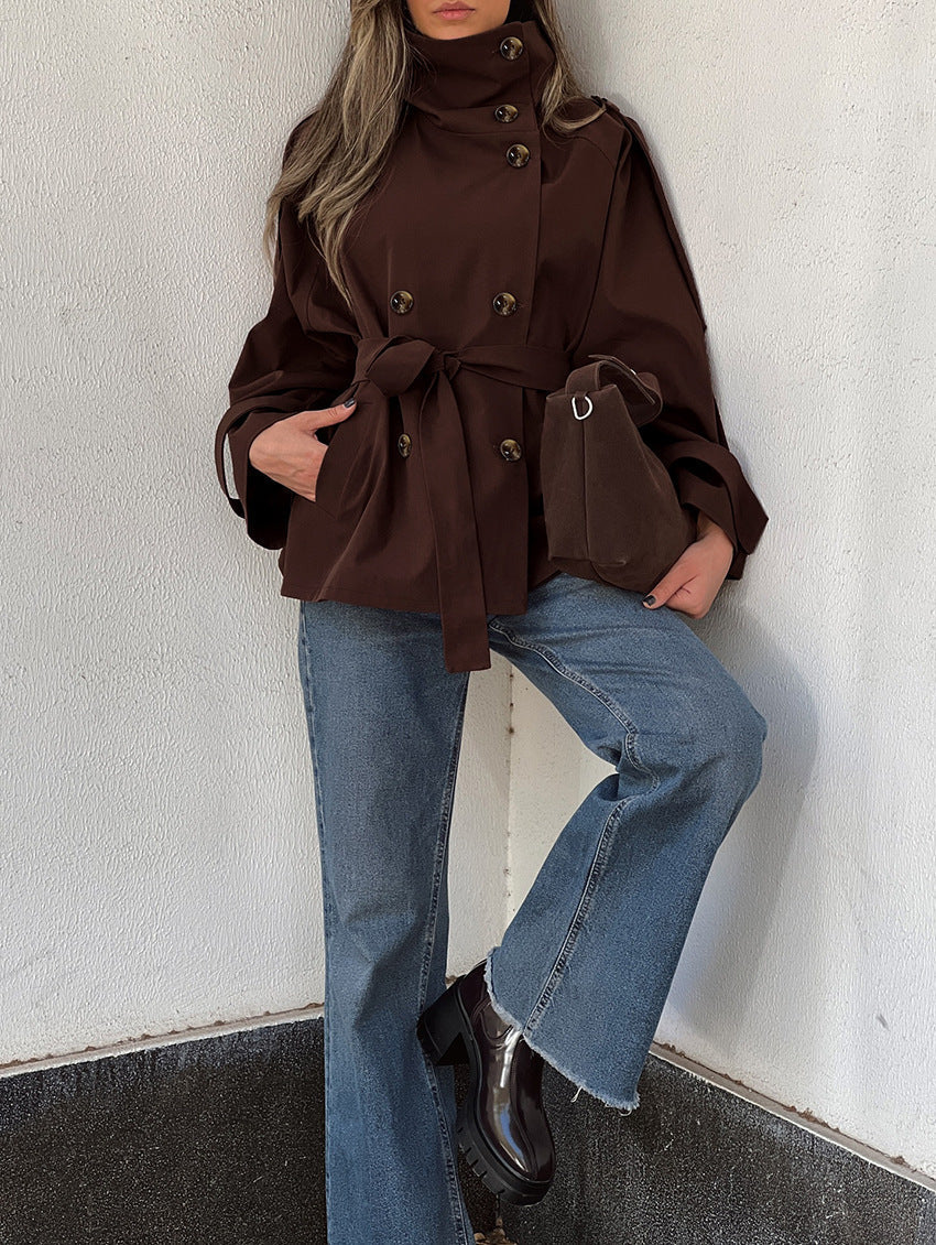 Women's brown trench coat with high collar, double-breasted buttons, belted waist and pockets