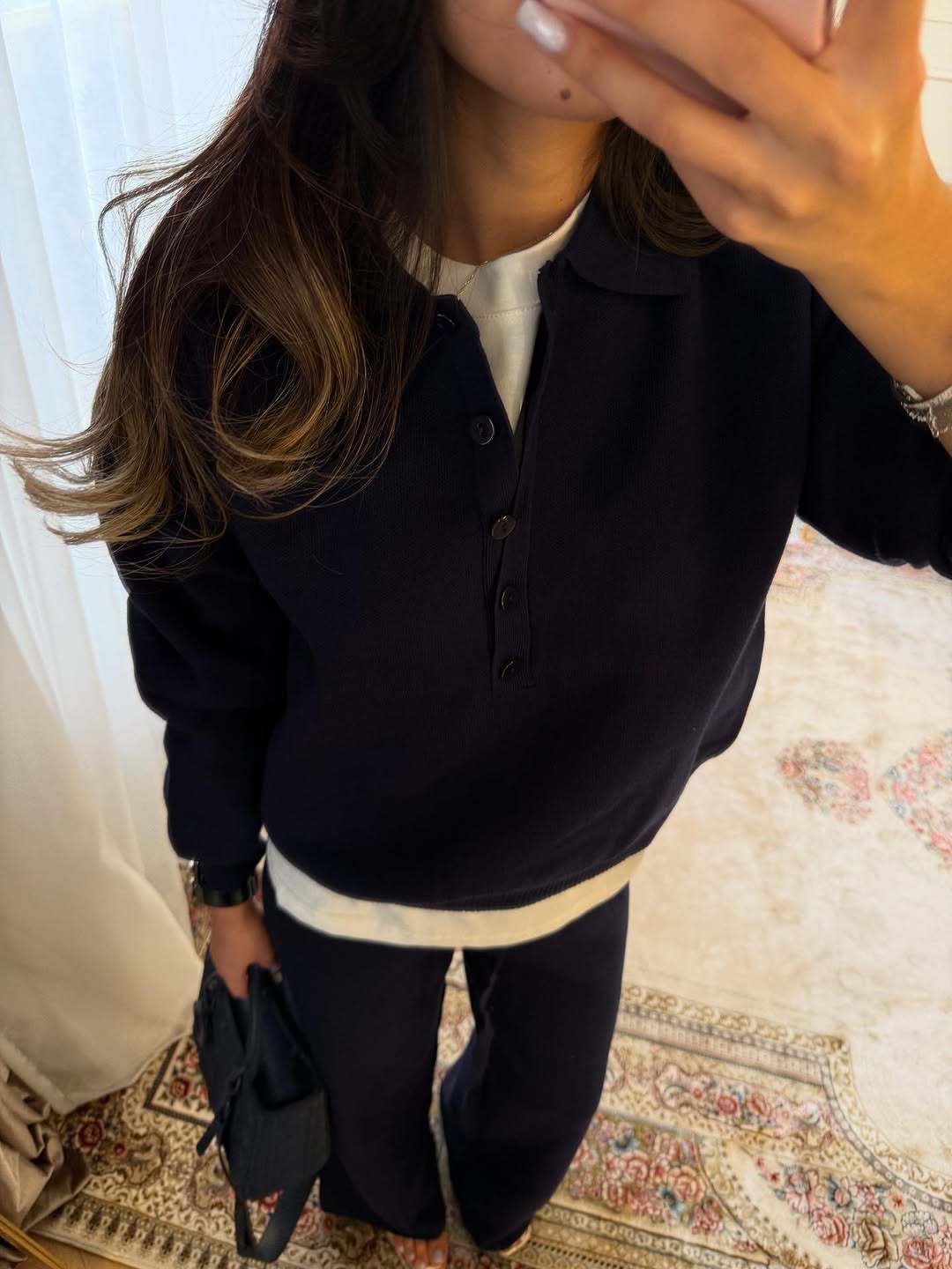 Navy knit polo-collar top with short button placket and matching wide-leg pants