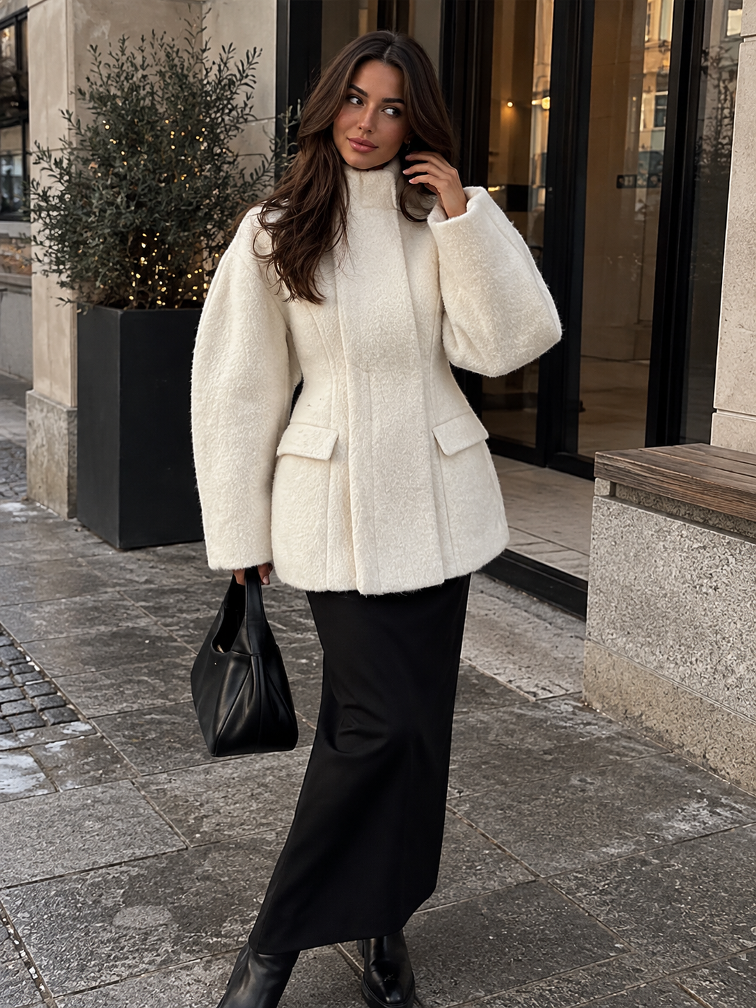 White wool coat with raised collar and flap pockets, button-front closure
