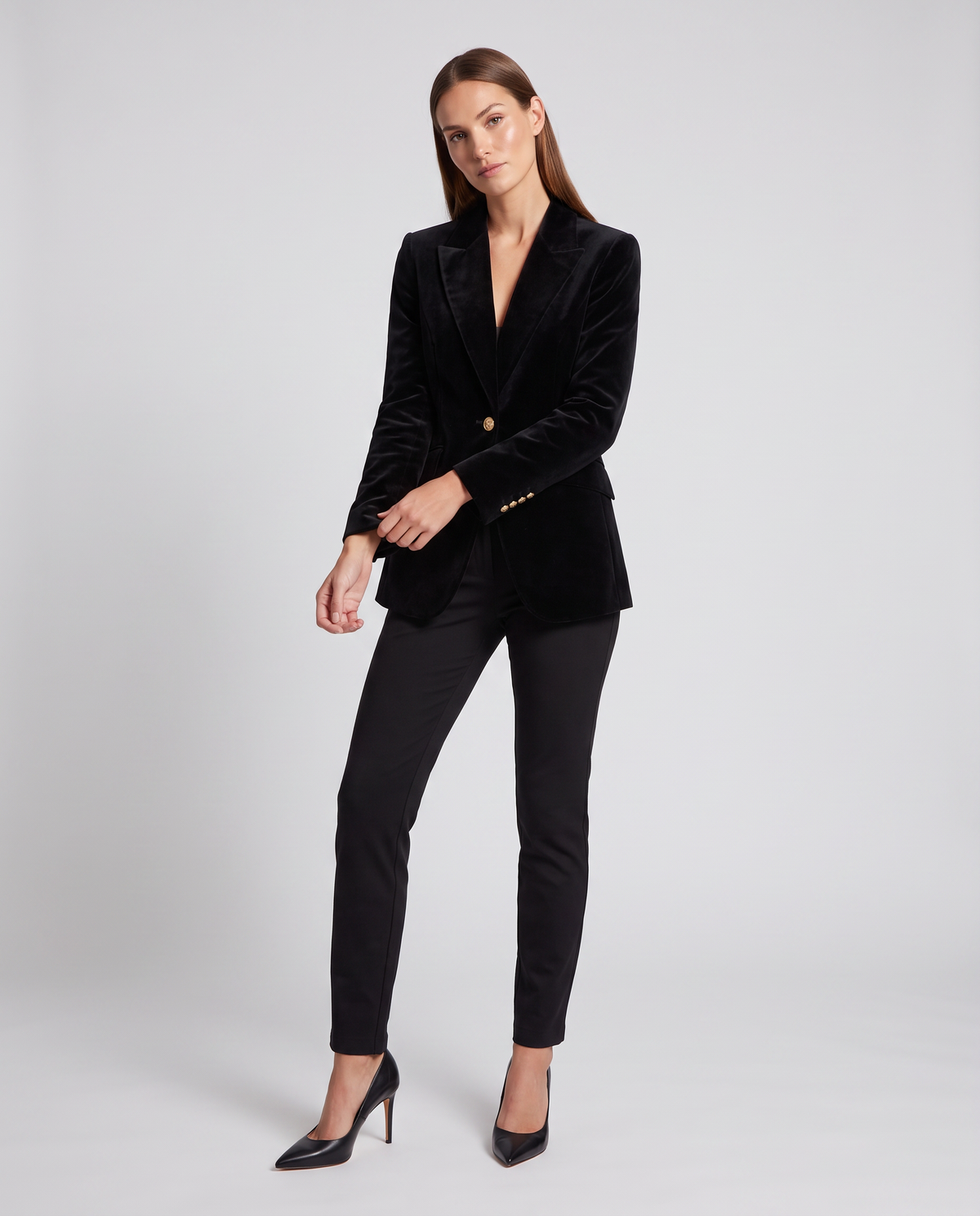 Black velvet tailored blazer with notch lapel and single gold button closure