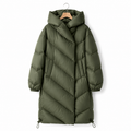 Women’s long green down puffer coat with hood, chevron quilting, and drawcord hem