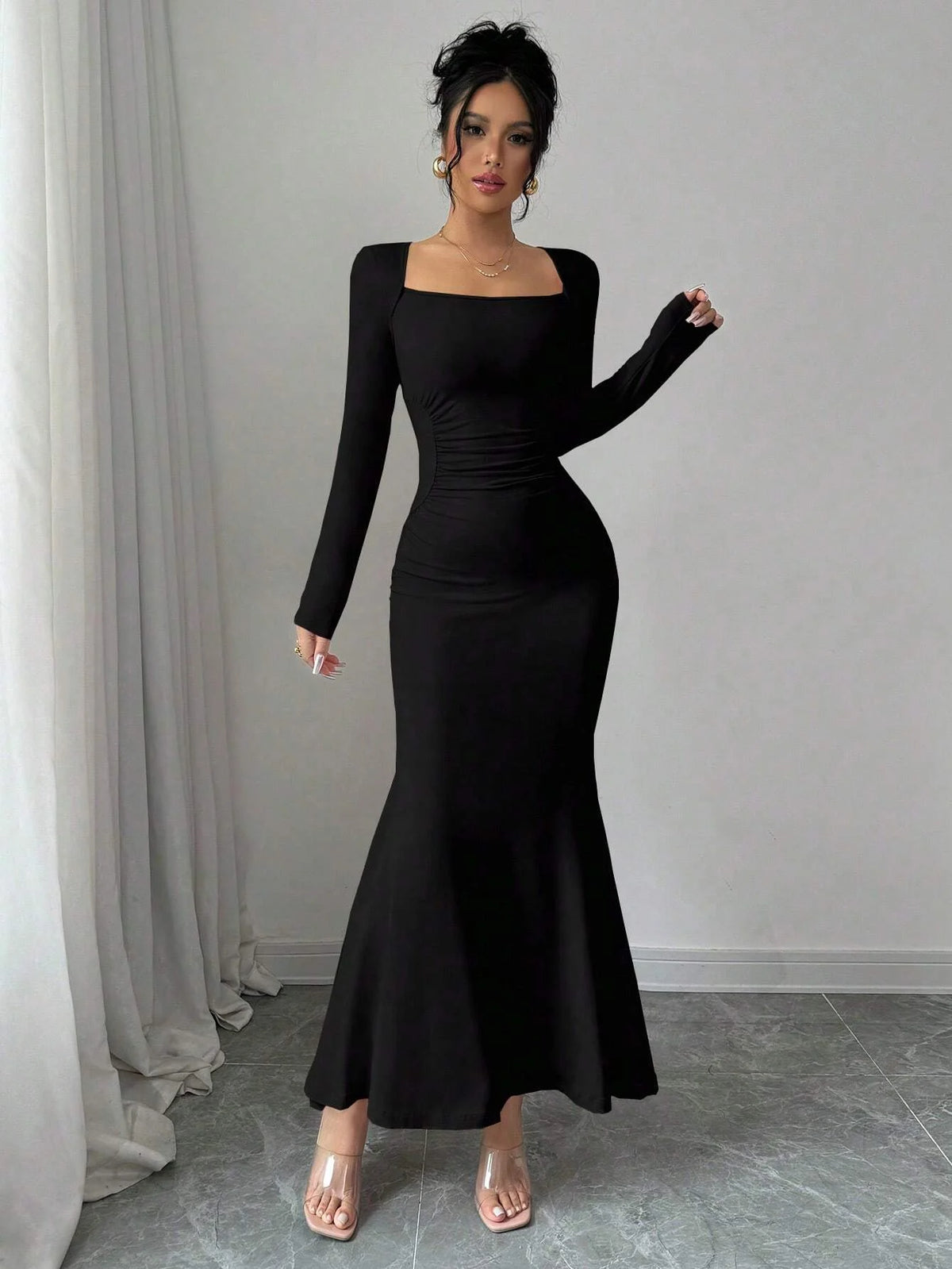 Black fitted long-sleeve dress with square neckline and mermaid hem