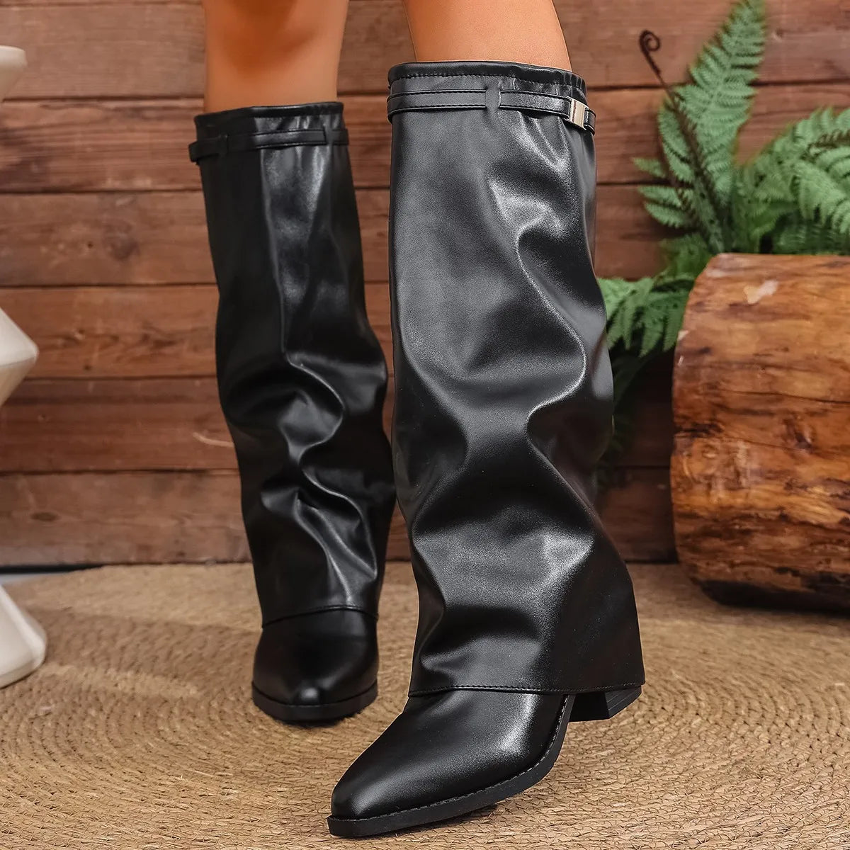 Black foldover wide-calf knee-high boots with foldover cuff and buckle detail