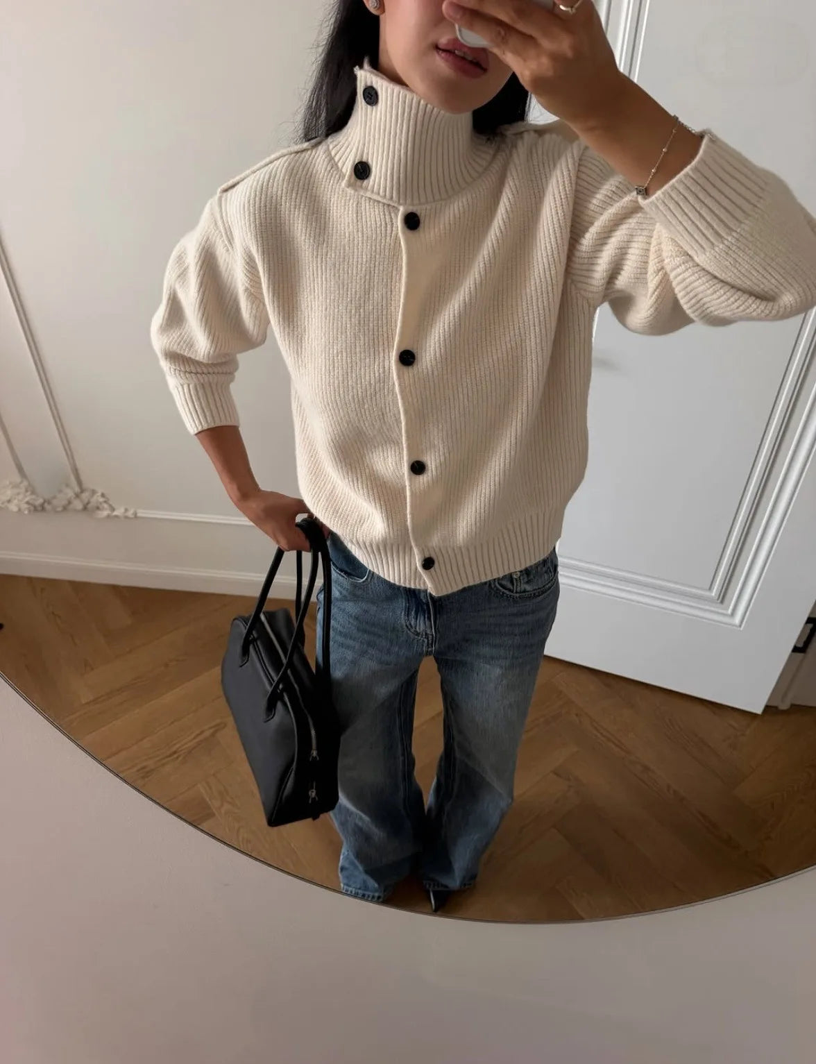 Cream knit turtleneck cardigan with loose fit and black-button front