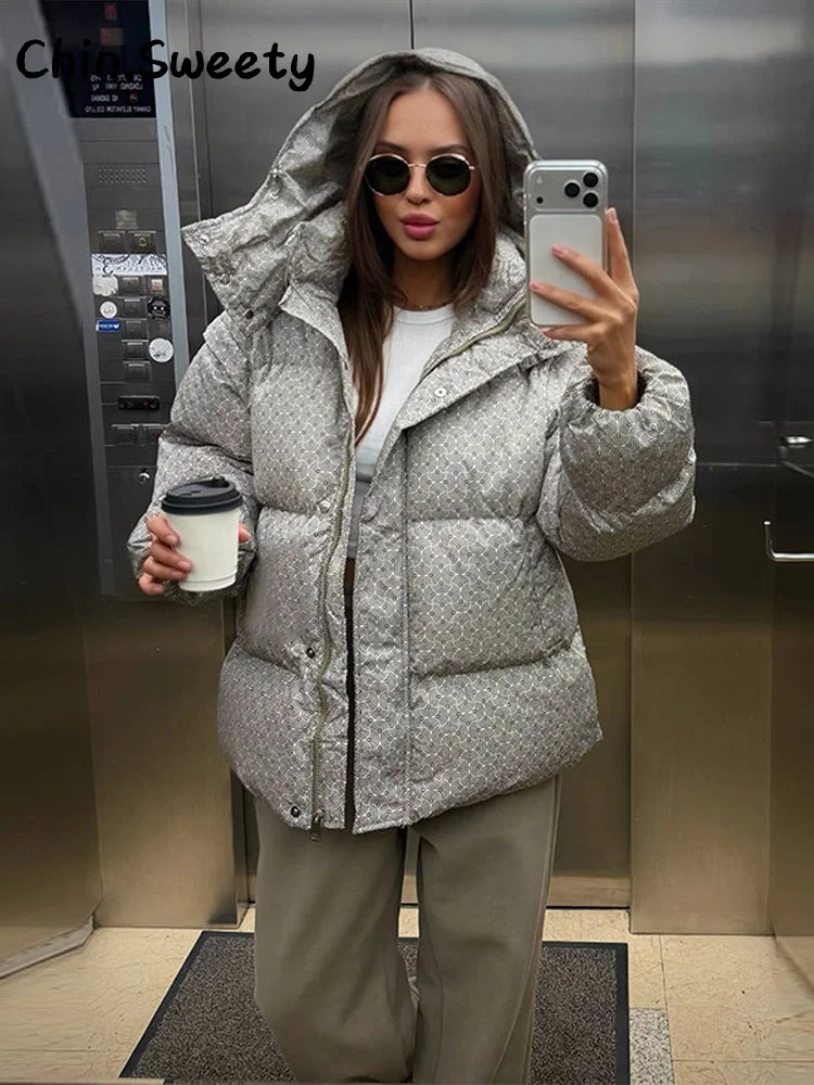 Gray printed puffer coat with oversized hood and button front