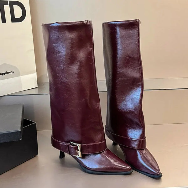 Burgundy knee-high stiletto boots with pointed toe and gold-tone buckle strap