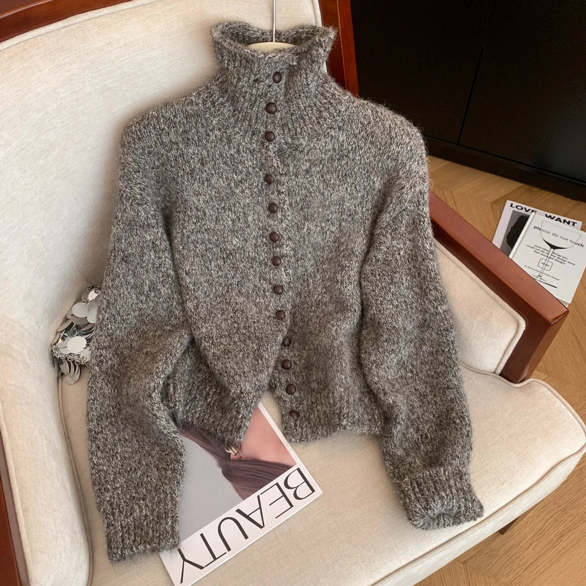 Dark grey knit turtleneck jumper with front buttons and long sleeves