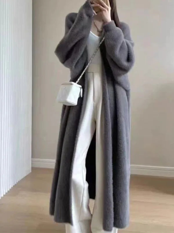 Charcoal gray faux-mink open coat with long sleeves and draped front
