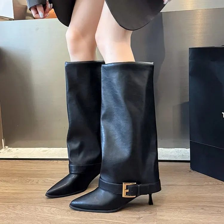 Black knee-high stiletto boots with pointed toe, slim buckle strap, and block heel