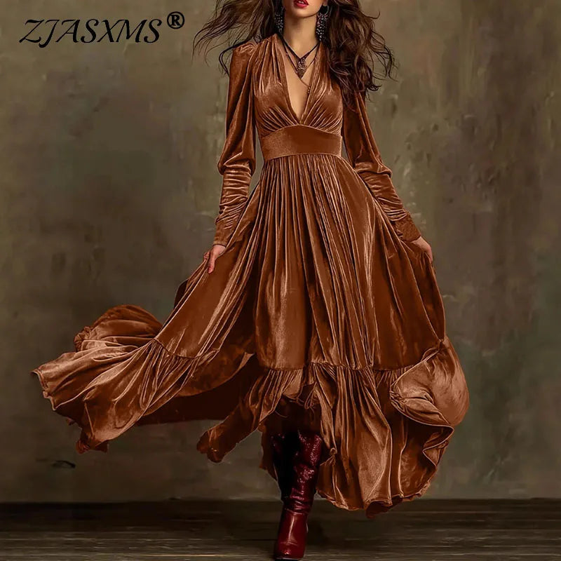 Cinnamon brown velvet maxi dress with deep V neck, long sleeves, gathered high-waist swing